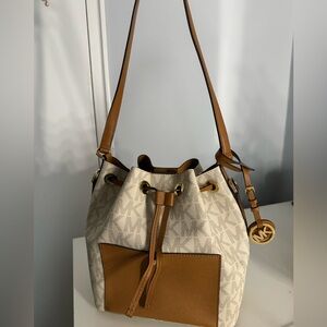 Michael Kors brown and white leather bag.